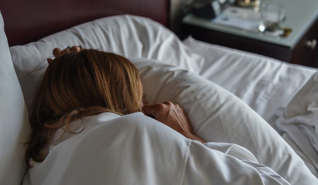 Person in bed sick