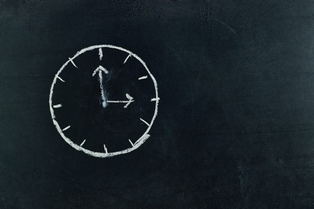Clock drawn on a blackboard